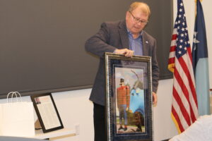 Past LMC Board of Directors President Ron Johnson shares his Paul Bunyan and Babe the Blue Ox portrait.