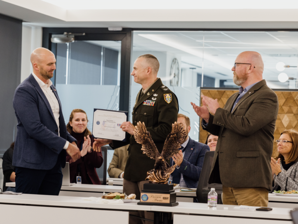 Patrick Arneson presents Luke Fischer with the ESGR Patriot Award