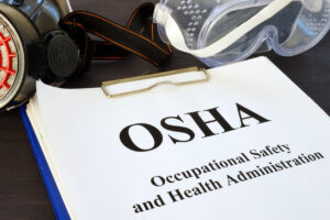 Pile of documents with Occupational Safety and Health Administration OSHA