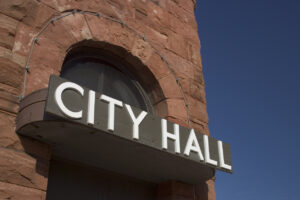 City Hall sign on a brick building